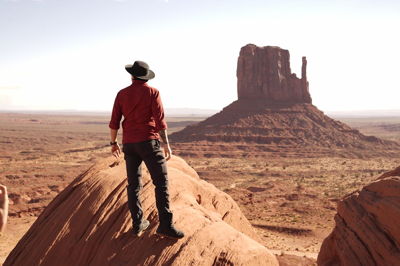 about-01 Lone traveler standing in awe of the scenic beauty of Monument Valley, Arizona.